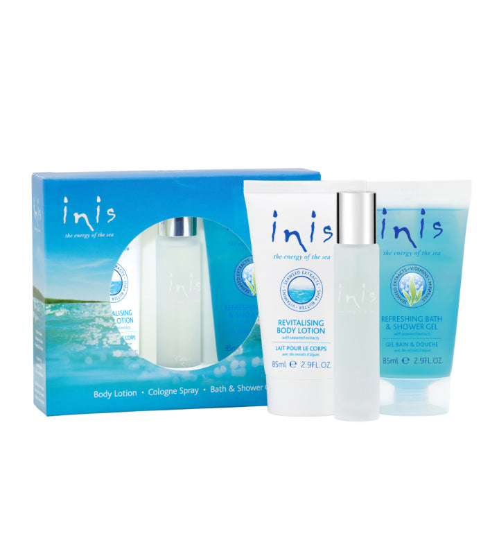 Inis skincare product set with body lotion, cologne spray, and bath & shower gel on a white background